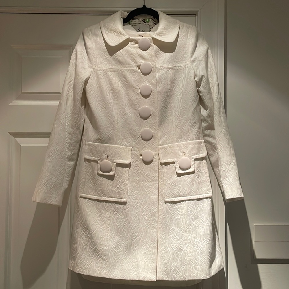 Molly of New York white coat and dress suit.